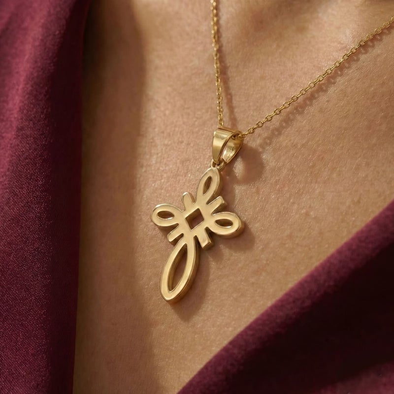 A large gold-tone cross pendant (chain not included), crafted from rust-resistant stainless steel, featuring a sleek, openwork knot design. A distinctive, modern, and spiritual piece. - Image 3